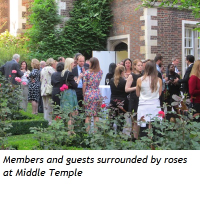 Members and guests surrounded by roses at Middle Temple